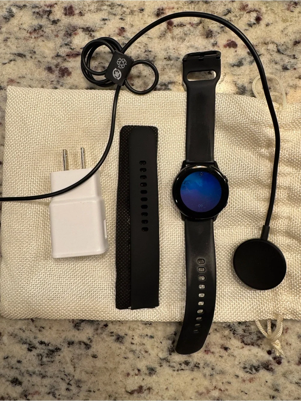 Samsung Black Smartwatch with Charging Cable and USB Adapter